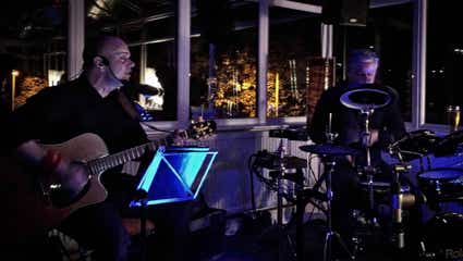 Bash and Strum playing an eveneing sit-down 80th birthday party